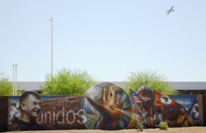 A mosaic mural on a fence wall of the massive Sky Harbor Rental Car Center marks the area where the Golden Gate barrio used to be, near the intersection of 16th Street and Buckeye Road, in South Phoenix. The barrio was razed in 1987. Photo by Eduardo Barraza | Barriozona Magazine © 2010