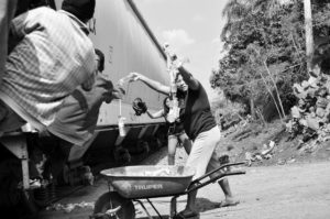 A group of women known as Las Patronas (after her hometown La Patrona, Veracruz, Mexico) have taken upon themselves to provide food and water to Central American migrants as they travel in freight trains. Photo: Joseph Sorrentino All Rights Reserved © 2012