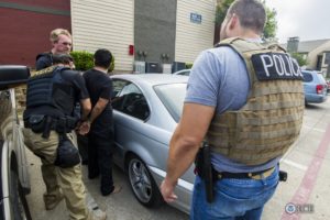 Immigration agents arrest an immigrant who was in the United States without authorization. Photo: ICE