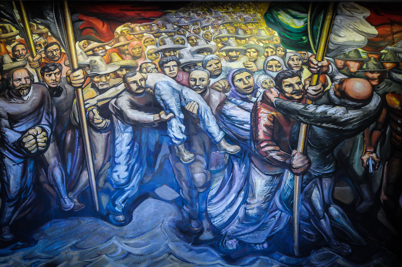 Detalle de un mural titulado "Porfirismo a la Revolución", de David Alfaro Siqueiros en el Castillo de Chapultepec, en la Ciudad de México. Siqueiros fue uno de los máximos exponentes del Movimiento Muralista Mexicano. Foto: Eduardo Barraza | Barriozona Magazine © 2017